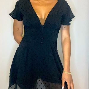 Black polka dot double layered dress with built in shorts.